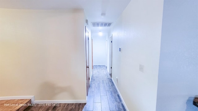 hallway with wood-type flooring