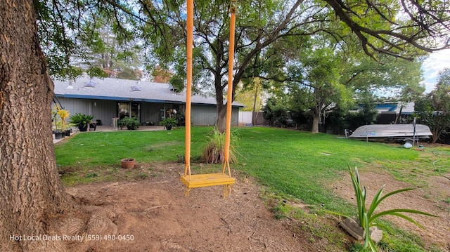 view of yard with a patio area and a trampoline