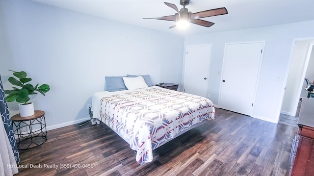 bedroom with dark hardwood / wood-style floors and ceiling fan