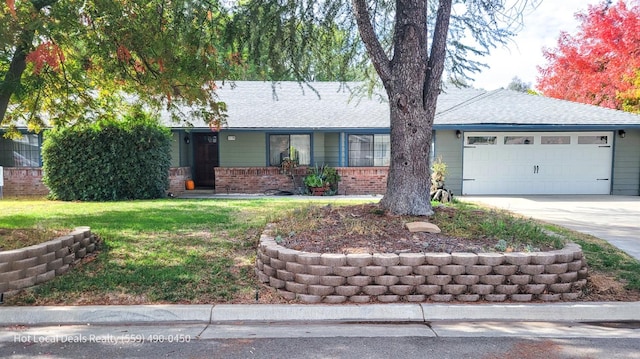 ranch-style home with a garage and a front yard