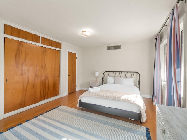 bedroom with light hardwood / wood-style flooring