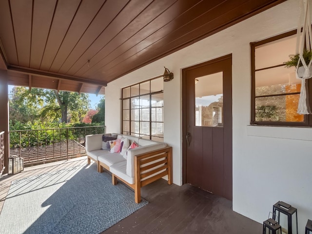 sunroom featuring wood ceiling