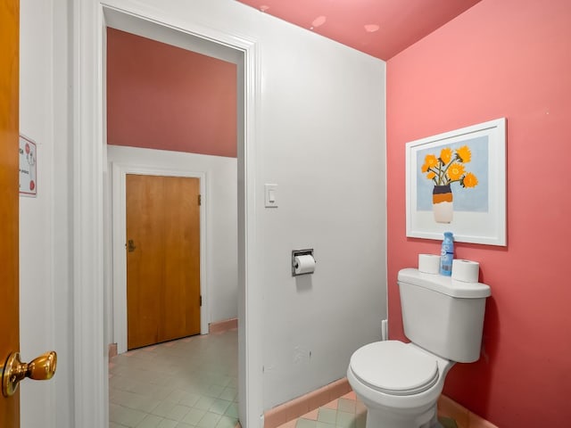 bathroom with tile patterned floors and toilet