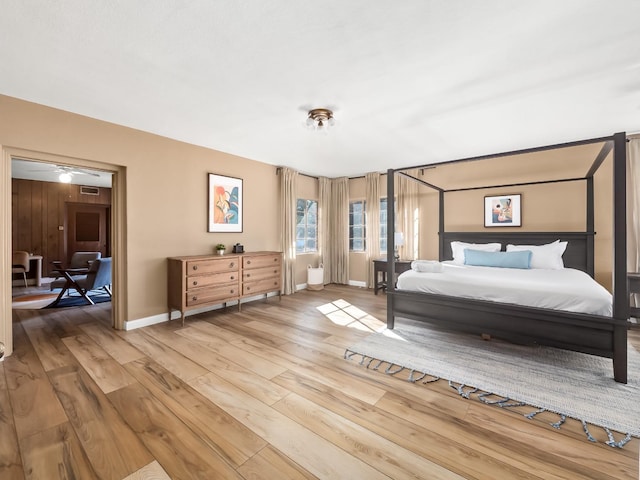 bedroom with hardwood / wood-style flooring