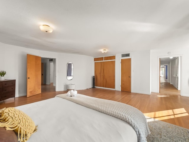 bedroom with hardwood / wood-style flooring