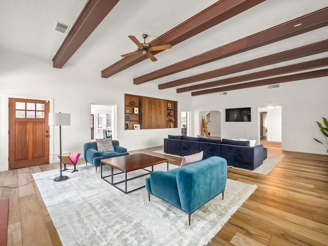 living room with beam ceiling, ceiling fan, and light hardwood / wood-style floors