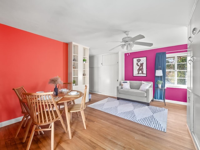 dining area featuring ceiling fan and light hardwood / wood-style flooring