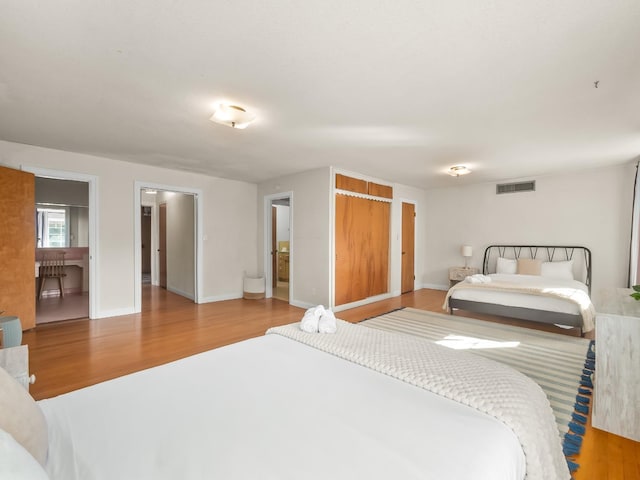 bedroom with light hardwood / wood-style floors