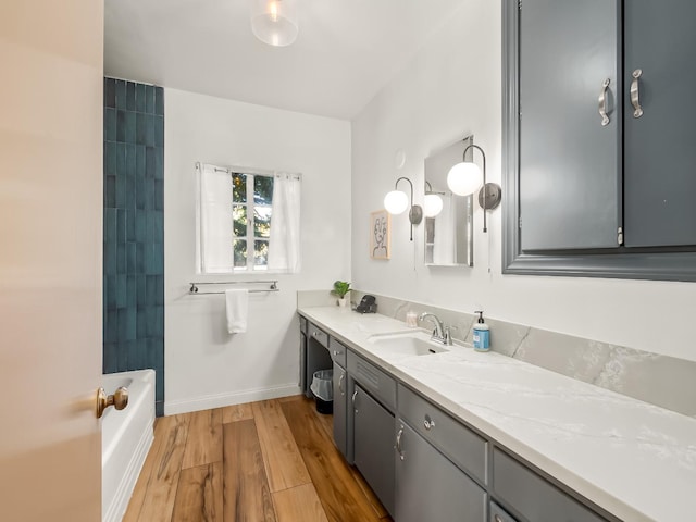 bathroom featuring shower / bathing tub combination, vanity, and wood-type flooring