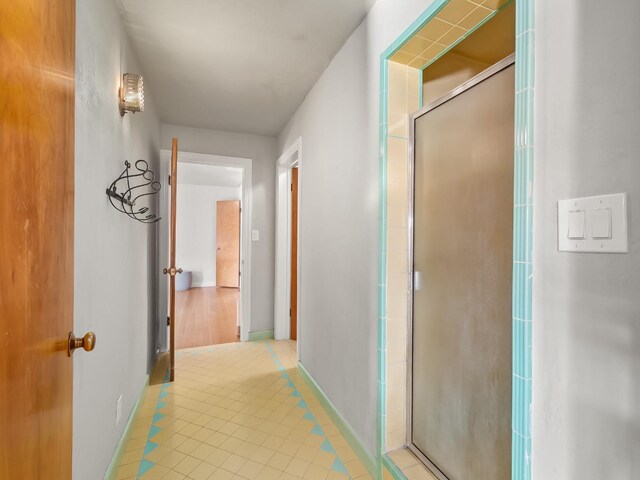 hallway featuring light tile patterned flooring