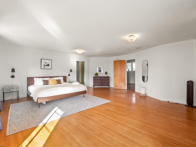 bedroom featuring hardwood / wood-style floors