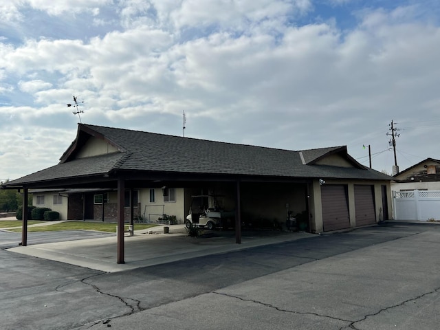 view of front facade with a carport