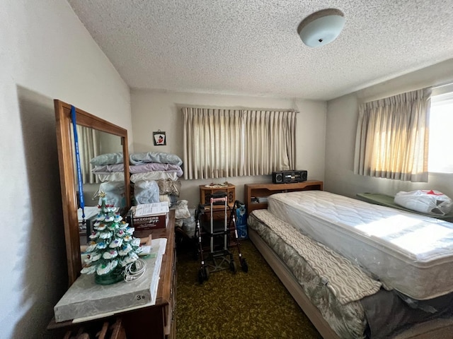 carpeted bedroom with a textured ceiling