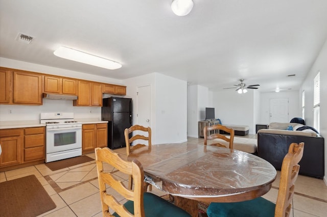 dining room featuring ceiling fan and light tile patterned floors