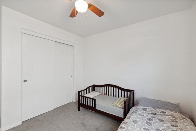 bedroom with carpet flooring, a closet, and ceiling fan