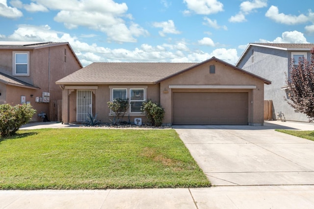 view of front of property featuring a garage and a front yard