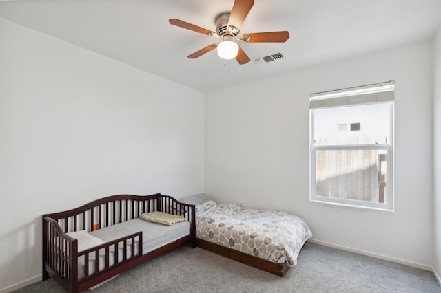 carpeted bedroom with ceiling fan