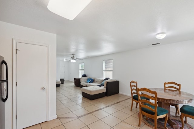 dining room featuring ceiling fan and light tile patterned floors