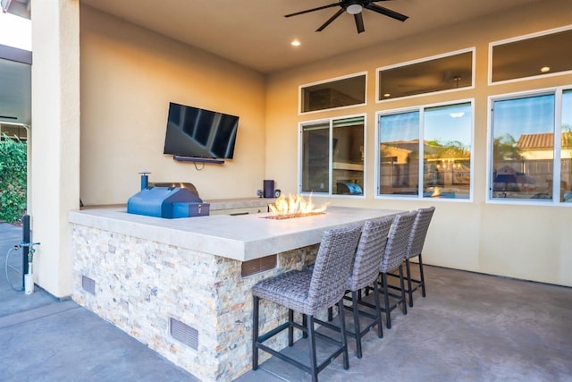 view of patio with ceiling fan, visible vents, and outdoor dry bar