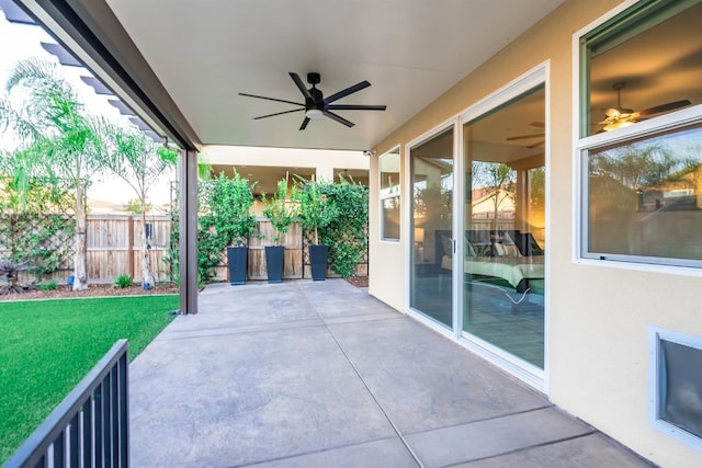 view of patio / terrace featuring fence and a ceiling fan