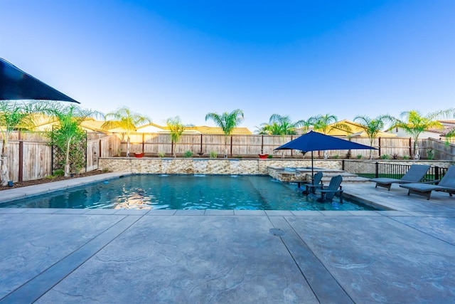 view of swimming pool featuring a patio area, a fenced backyard, and a fenced in pool