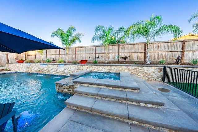 view of swimming pool with an in ground hot tub, a fenced backyard, and a fenced in pool