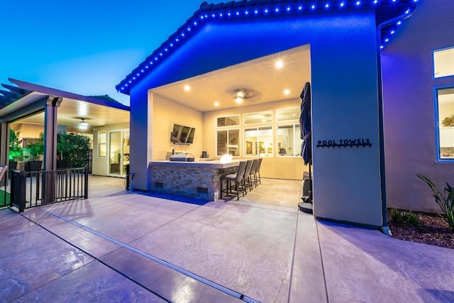 view of patio / terrace with exterior kitchen and outdoor wet bar