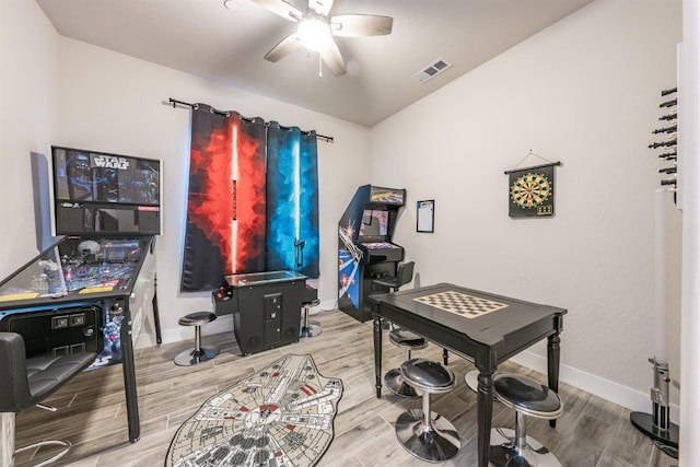 office area with visible vents, ceiling fan, baseboards, and wood finished floors