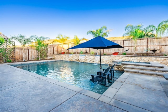 view of swimming pool with a fenced in pool, a patio area, and a fenced backyard