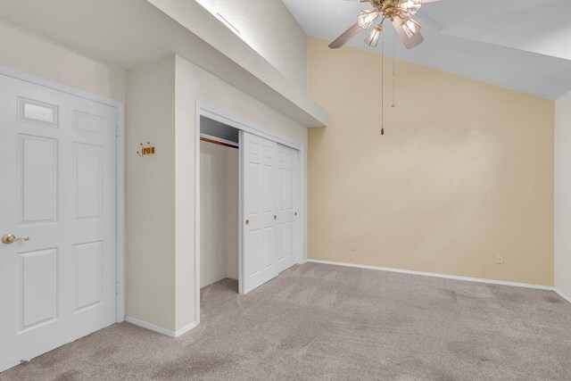 unfurnished bedroom featuring ceiling fan and light colored carpet