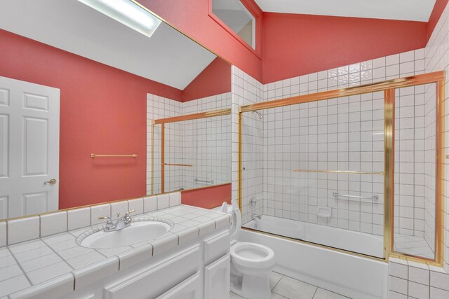 full bathroom with tile patterned flooring, toilet, enclosed tub / shower combo, and vaulted ceiling