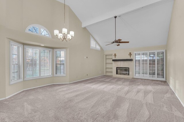 unfurnished living room with light carpet, high vaulted ceiling, and plenty of natural light