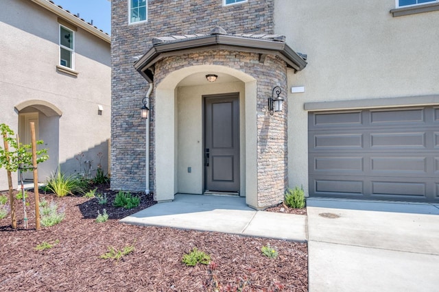 doorway to property featuring a garage