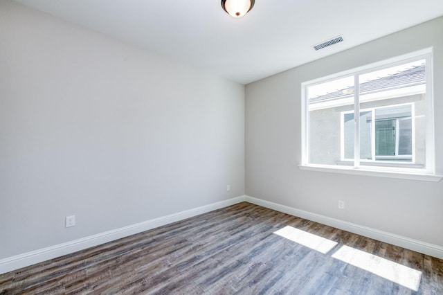 spare room with hardwood / wood-style floors