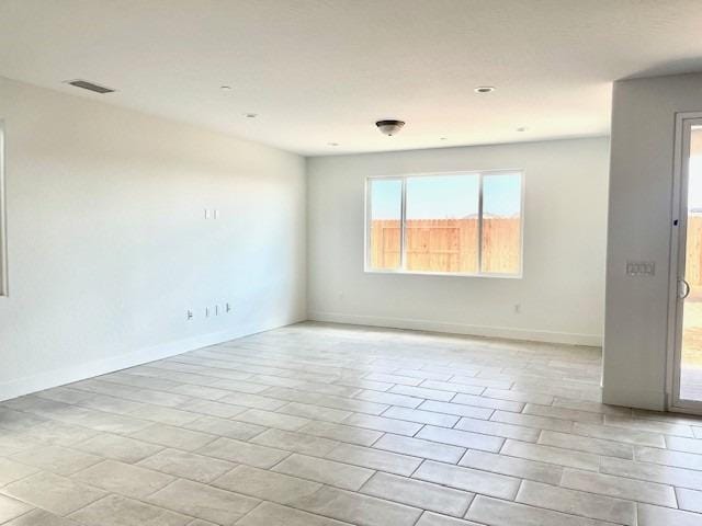 unfurnished room featuring light tile patterned floors