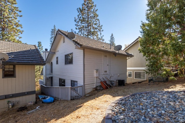 back of house featuring central AC