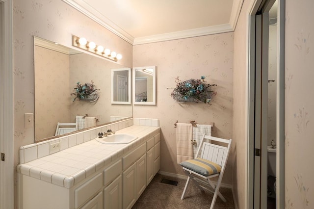 bathroom with vanity and ornamental molding