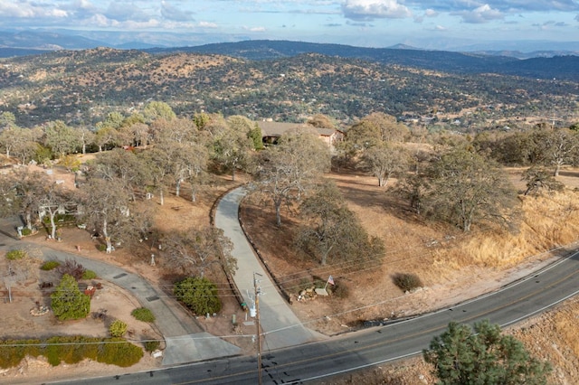 drone / aerial view featuring a mountain view