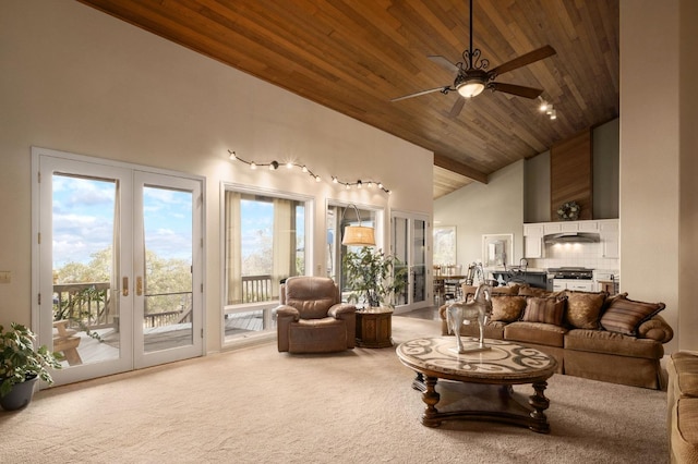 living room with ceiling fan, french doors, light colored carpet, and wood ceiling