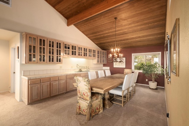 carpeted dining room with wood ceiling, a chandelier, and lofted ceiling with beams