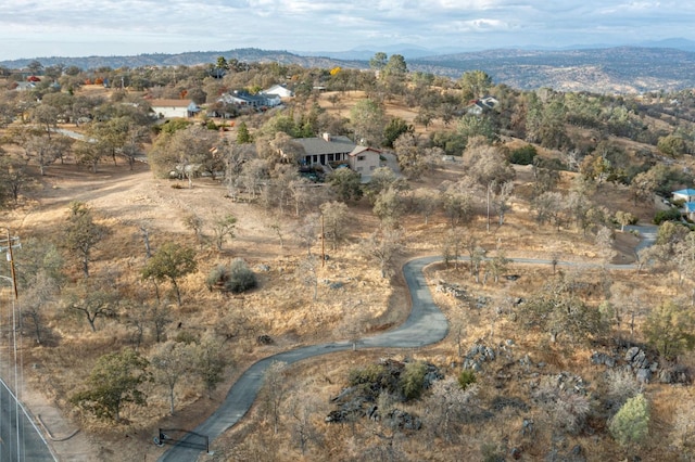 drone / aerial view featuring a mountain view