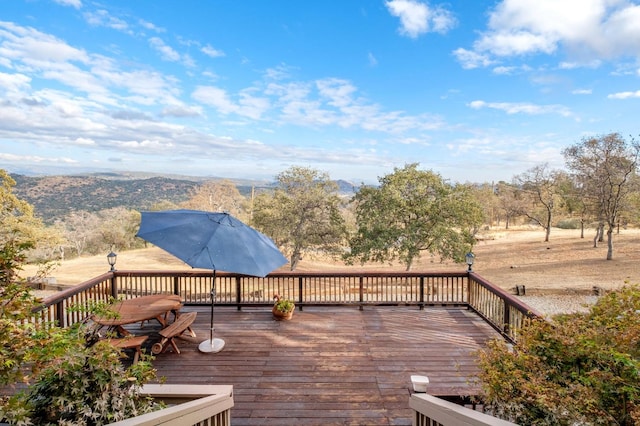 wooden terrace featuring a mountain view