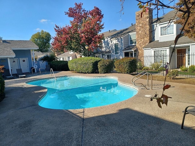 view of swimming pool featuring a patio area