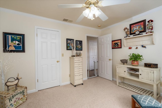 carpeted bedroom featuring ceiling fan and ornamental molding