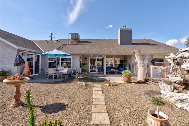 rear view of house featuring a patio