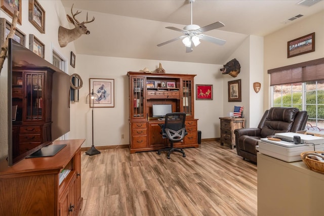 home office with light wood-type flooring, ceiling fan, and lofted ceiling