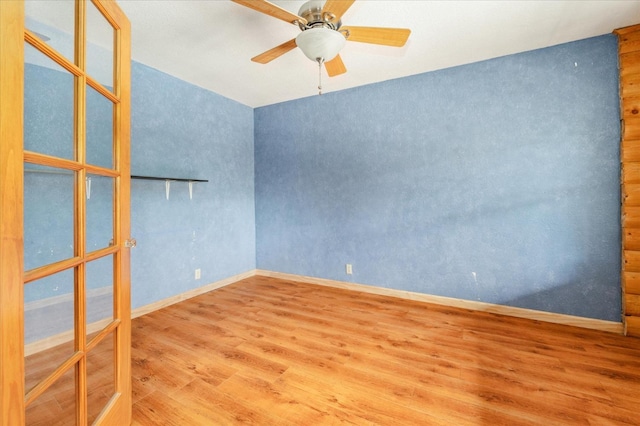 unfurnished room with ceiling fan and hardwood / wood-style floors