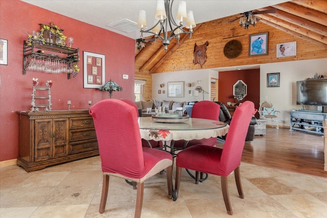 dining room with lofted ceiling with beams, a chandelier, and light hardwood / wood-style flooring