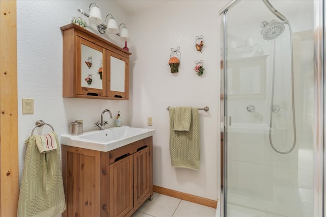 bathroom featuring vanity, tile patterned floors, and a shower with shower door