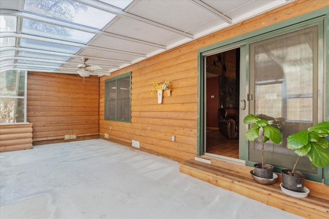 exterior space featuring ceiling fan